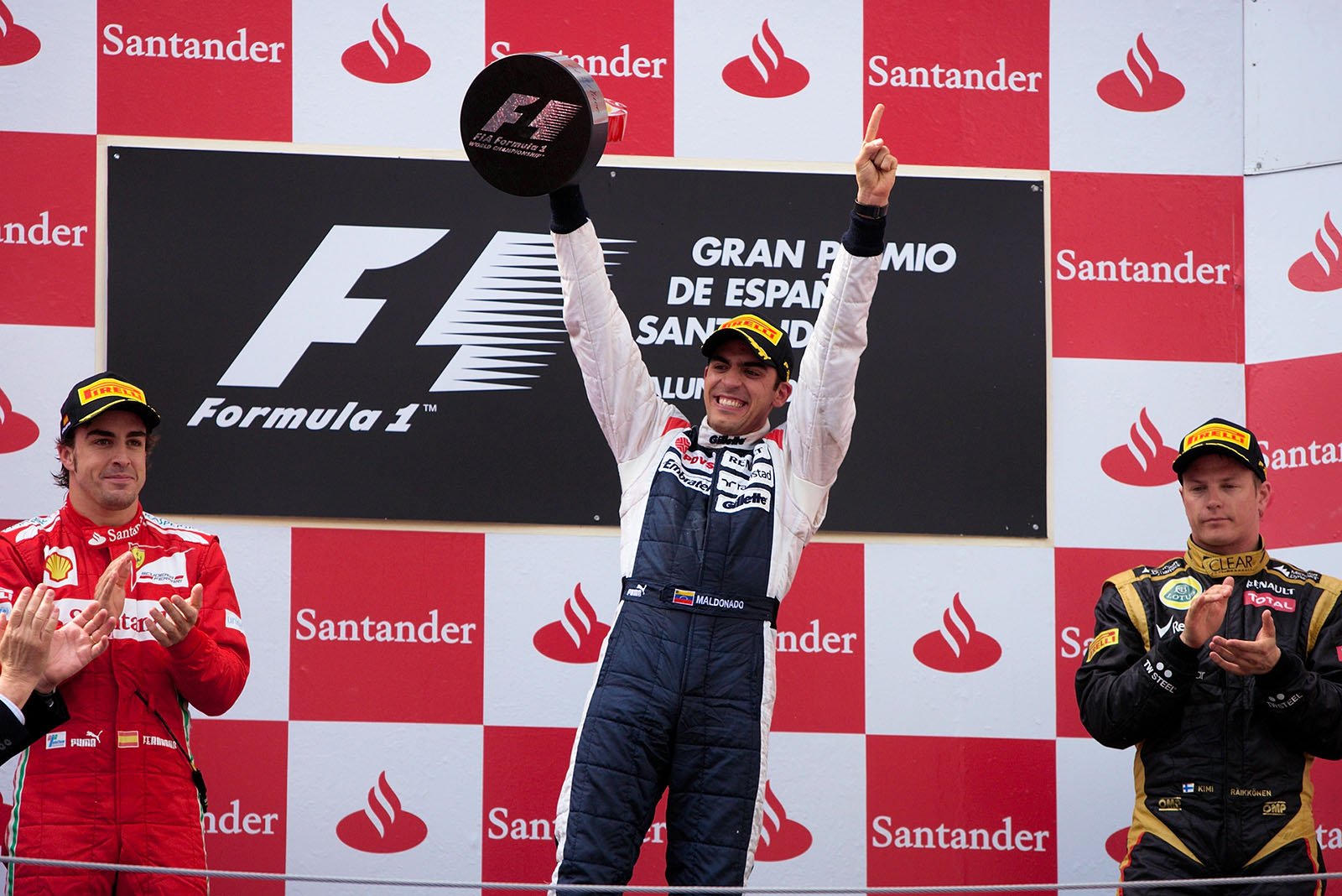 A victorious Pastor Maldonado of Williams presents his trophy on the podium after winning the Spanish Grand Prix 2012