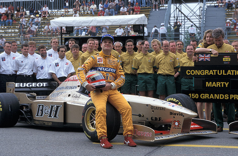 Rubens Barrichello poses in front of his Jordan-Peugeot 196 for the Jordan team's annual presentation photo