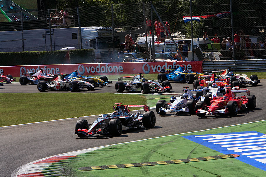 Starting field going through first chicane, Schumacher battling against Heidfeld