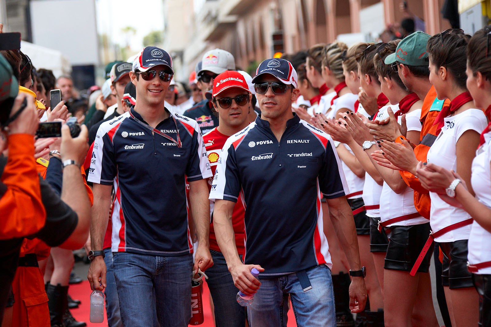 South American Williams drivers Senna and Maldonado walk to drivers parade