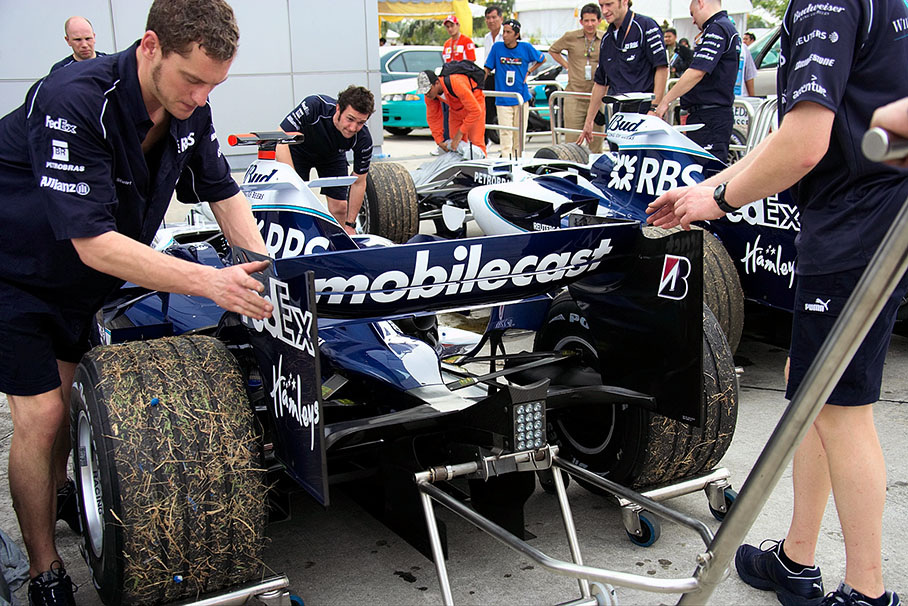 Both Williams being towed back after the race with blown-up engines
