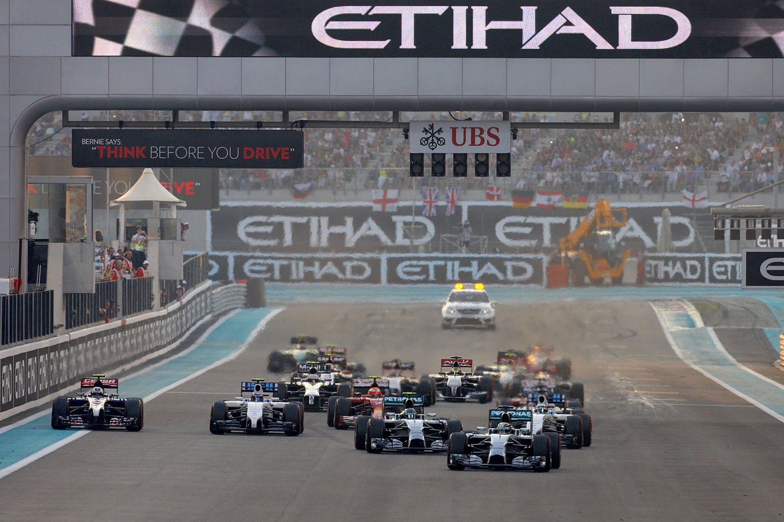 Lewis Hamilton, Mercedes, got a better start than his team-mate Rosberg and jumps into the lead, Abu Dhabi Grand Prix, 2014