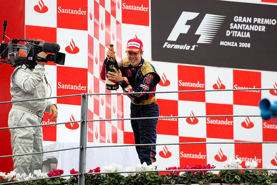 Youngest Grand Prix winner of all times Sebastian Vettel showers his Toro Rosso team with champagne