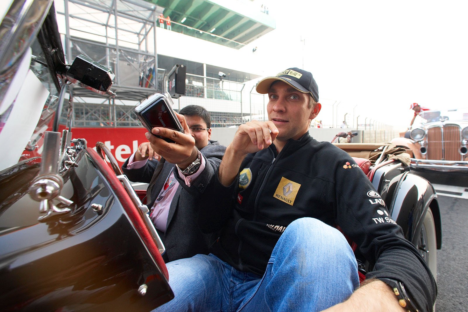 A shy Vitaly Petrov prepares for a lap of drivers parade