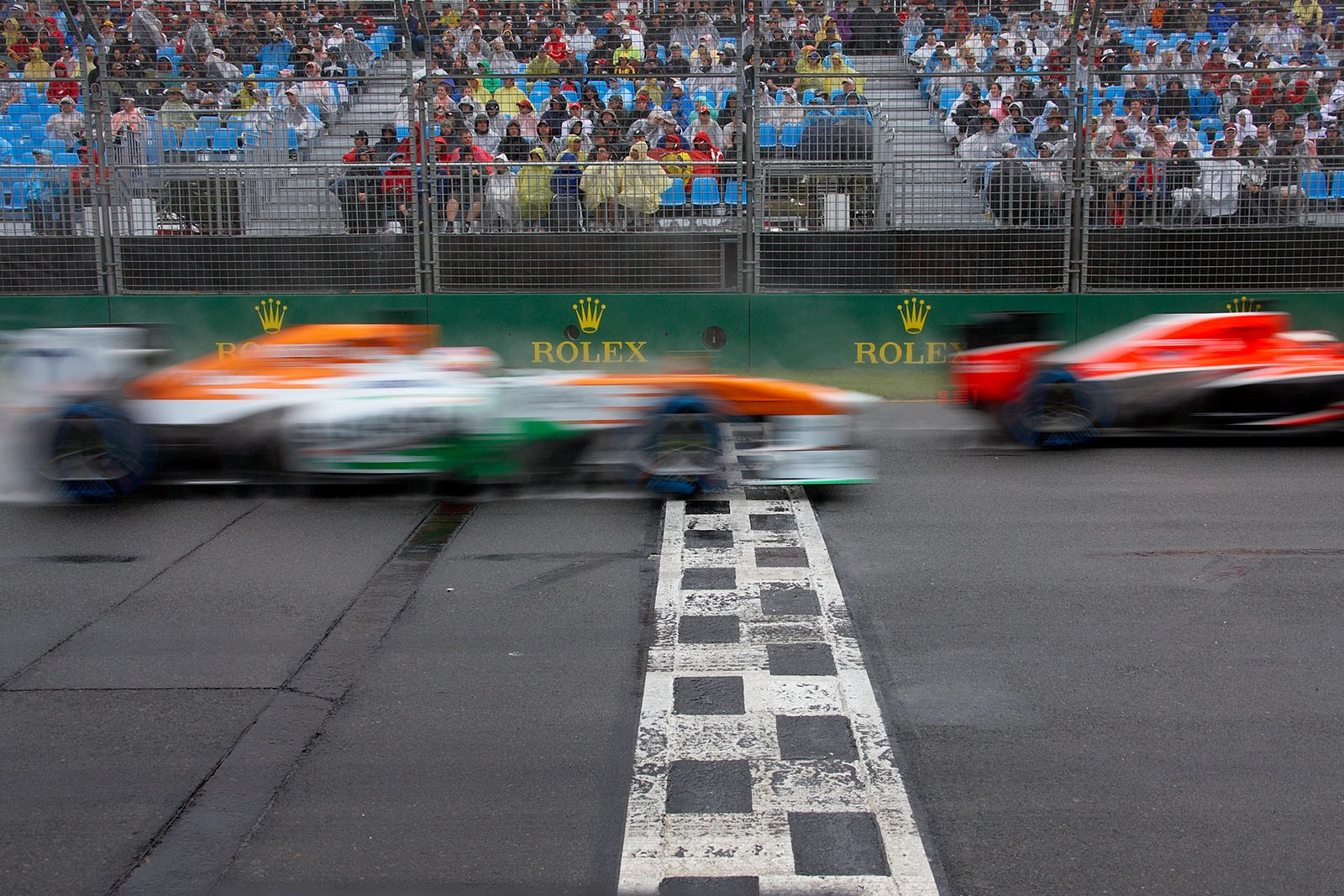 Adrian Sutil, Force India F1 Team, passes the finish line