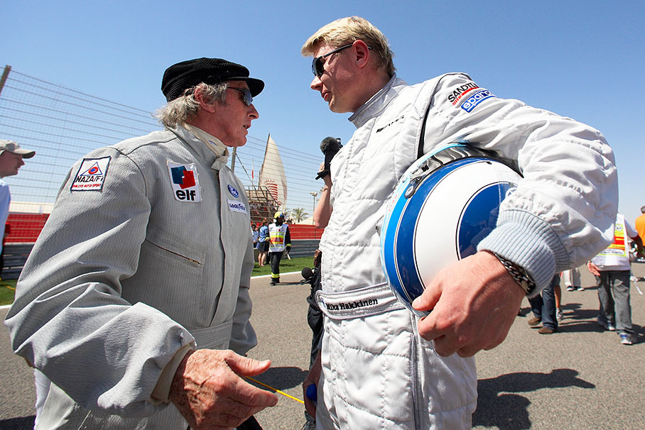 Triple World Champion Sir Jackie Stewart (1969, 1971 and 1973) talks with double World Champion Mika Hakkinen (1998 and 1999)
