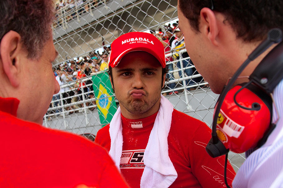 Felipe Massa besides the grid with father and son Todt (Ferrari and Felipe's boss Jean Todt, his son Nicolas is Felipe's manager)