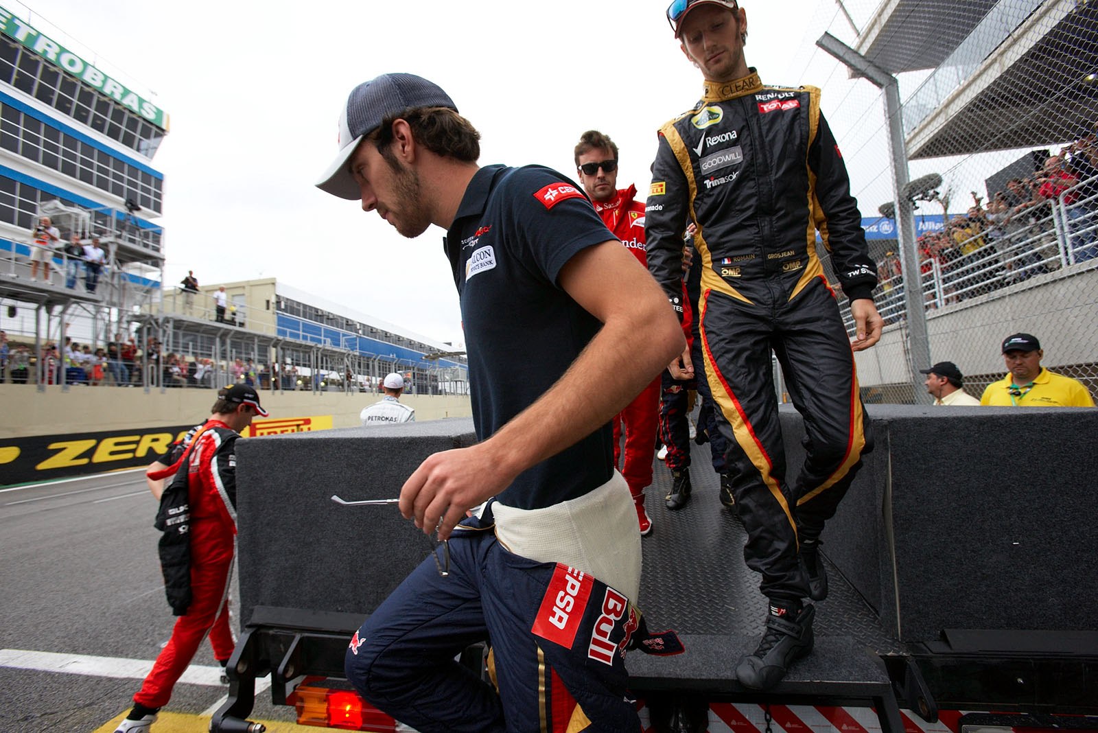 Daniel Ricciardo of Toro Rosso and Romain Grosjean on their way to drivers presentation