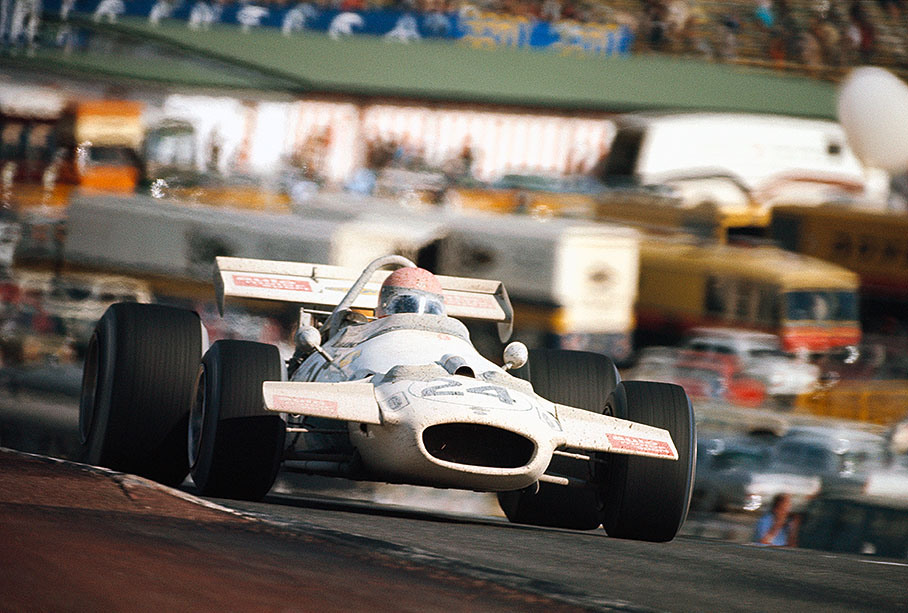 Rolf Stommelen in a Brabham-Cosworth BT33, covered with fire distinguisher spray from passing an accident at another corner after the start of the Spanish GP 1970