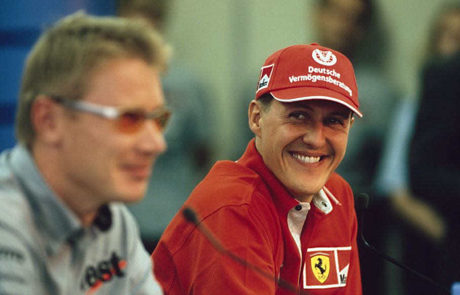 Michael Schumacher and Mika Häkkinen have fun during press conference