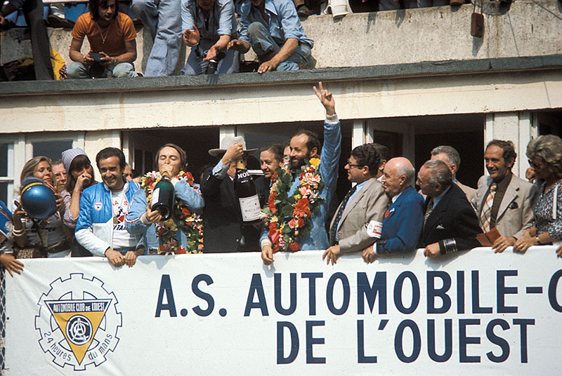 The winners of the 24h Le Mans Henri Pescarolo and Gerard Larrousse celebrate on podium