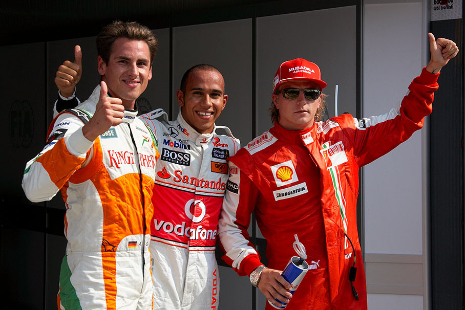 The fastest three qualifiers pose for the media after qualifying in parc ferme: the unexpexted second positioned Adrian Sutil of Force India F1 team, McLaren's polesitter Lewis Hamilton and third grid placed Kimi Raikkonen of Ferrari