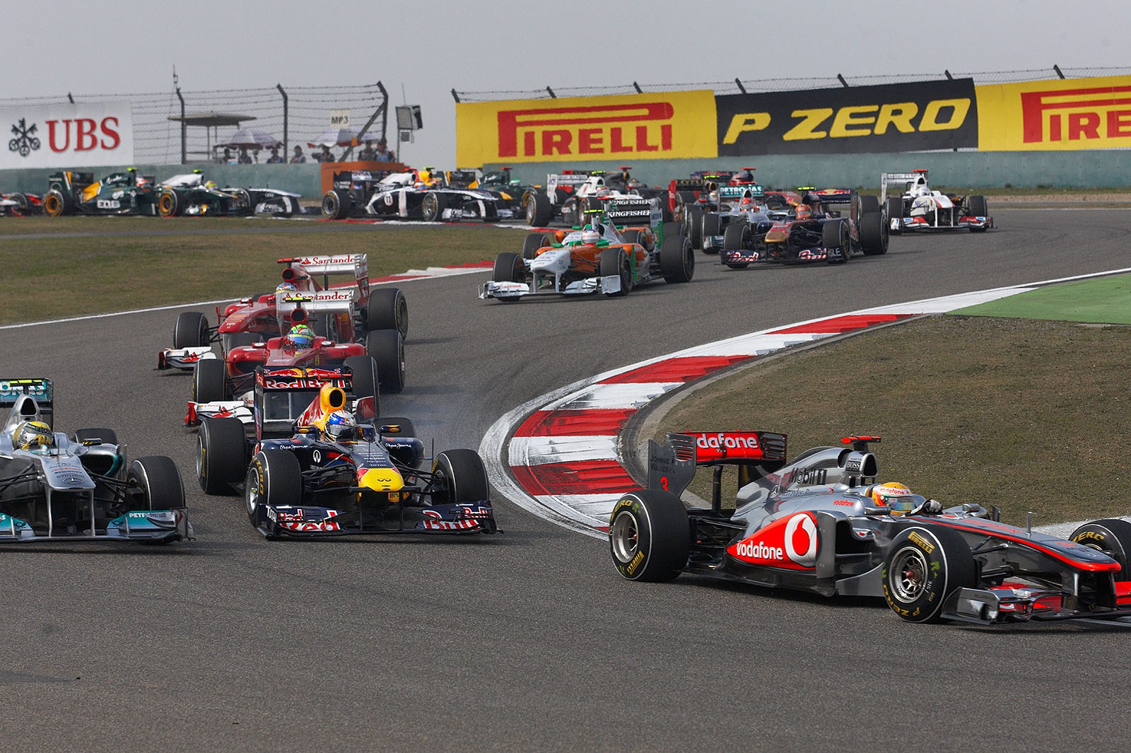 Vettel and Rosberg go through first chicane side-by-side on third position