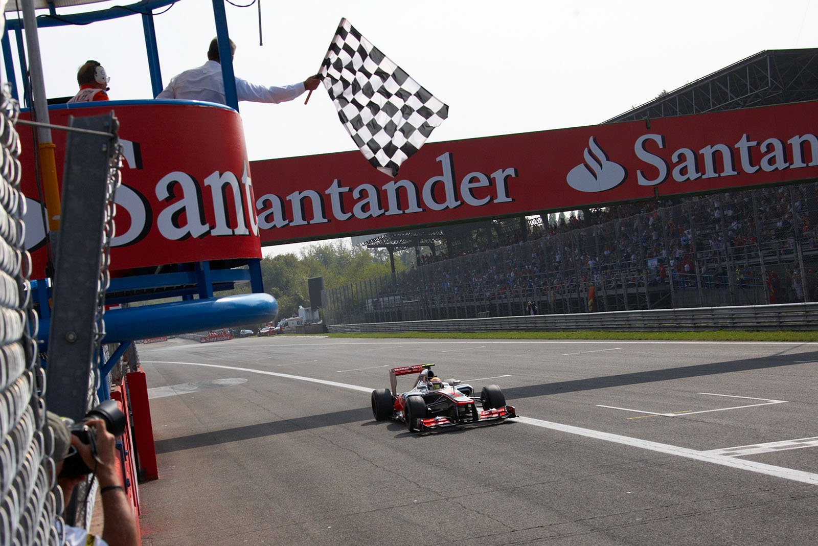 Lewis Hamilton, McLaren Mercedes, takes the chequered flag and wins the Italian Grand Prix