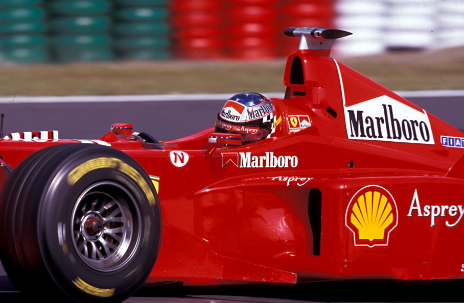 Michael Schumacher wearing the "tailormade" helmet made by Peter Ginneken of BELL Helmets S.A.