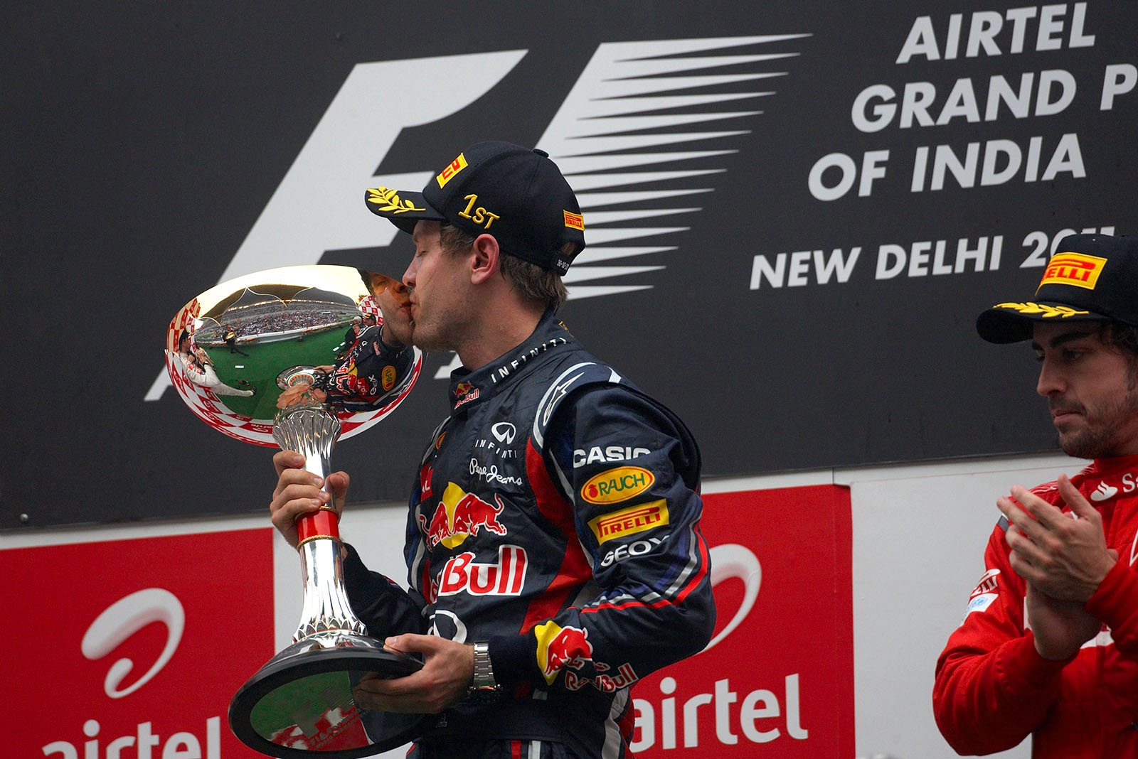 Sebastian Vettel, Red Bull Racing, kisses his shiny silver cup