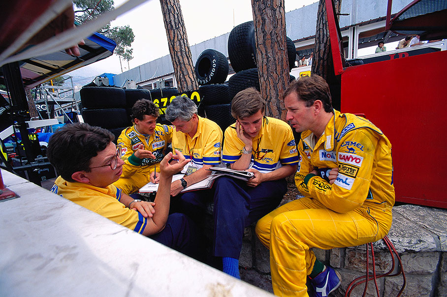 Benetton drivers Michael Schumacher and Martin Brundle discuss setup with their engineers