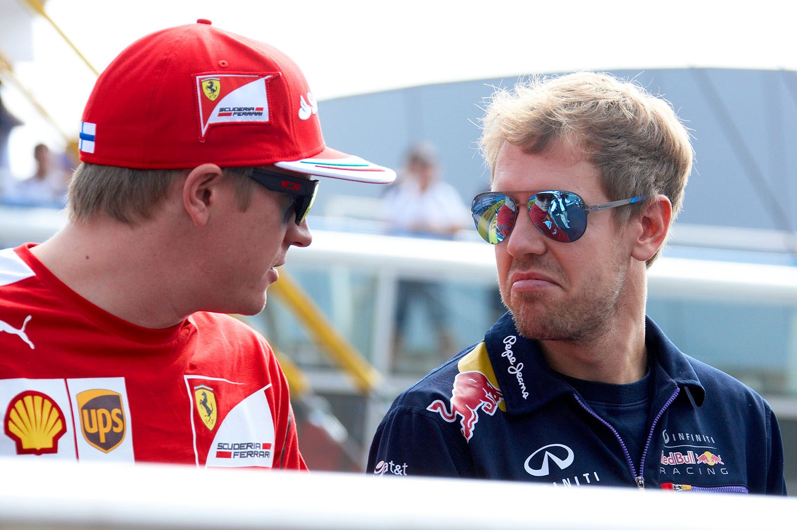 Raikkonen and Sebastin Vettel sitting on the drivers parade truck