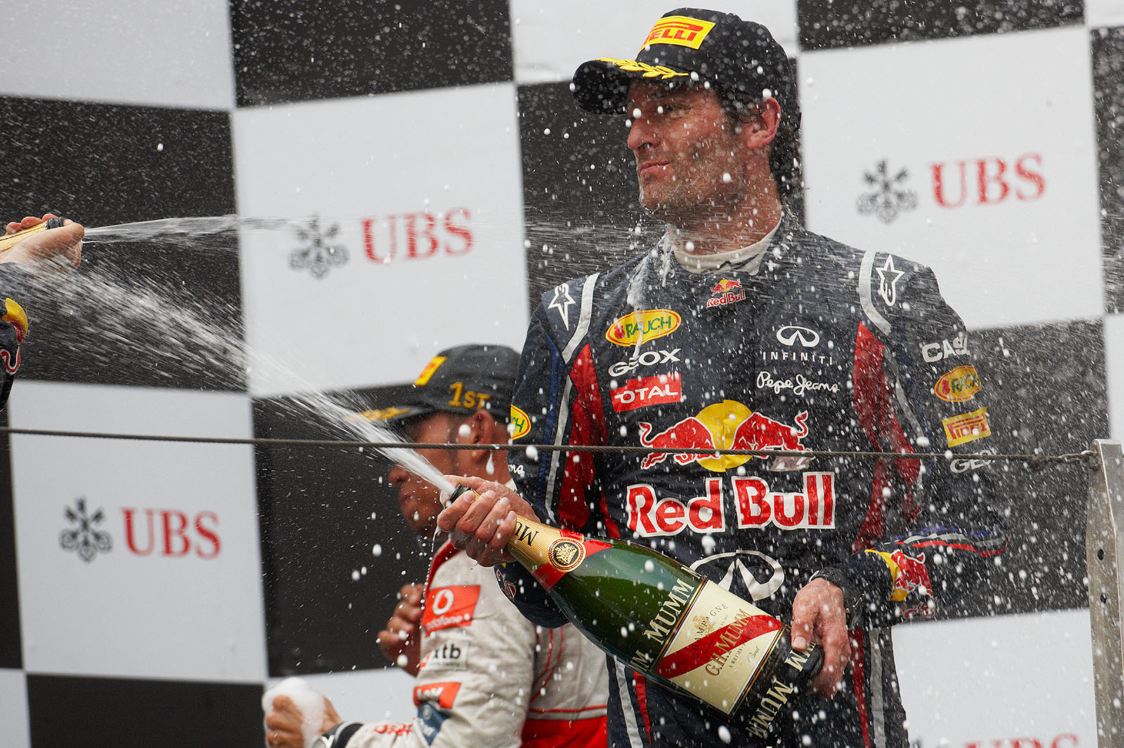 Red Bull's third placed Mark Webber sprays champagne after the Chinese GP