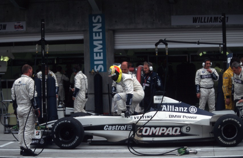 Ralf Schumacher leaves his car at pits with pneumatic valve trouble.