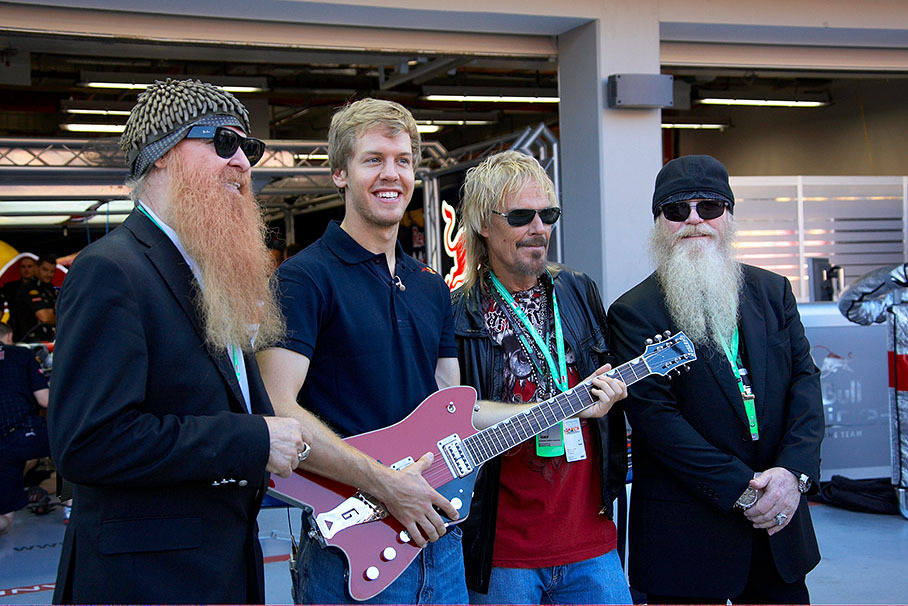 Billy Gibbons, Dusty Hill and Frank Beard of the American bluesrock band ZZ Top visit Sebastian Vettel in Red Bull pits