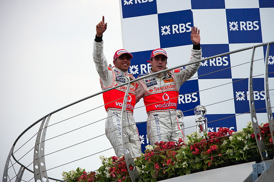 McLaren team mates and brothers in arms Lewis Hamilton and Fernando Alonso appear on the podium