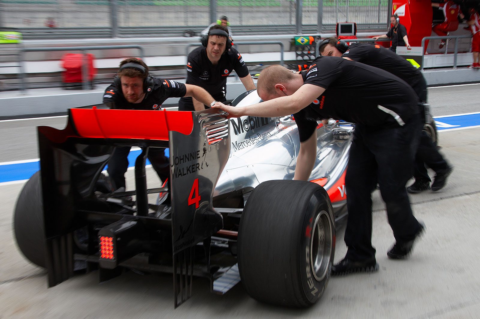 Jenson Button backs to McLaren pits