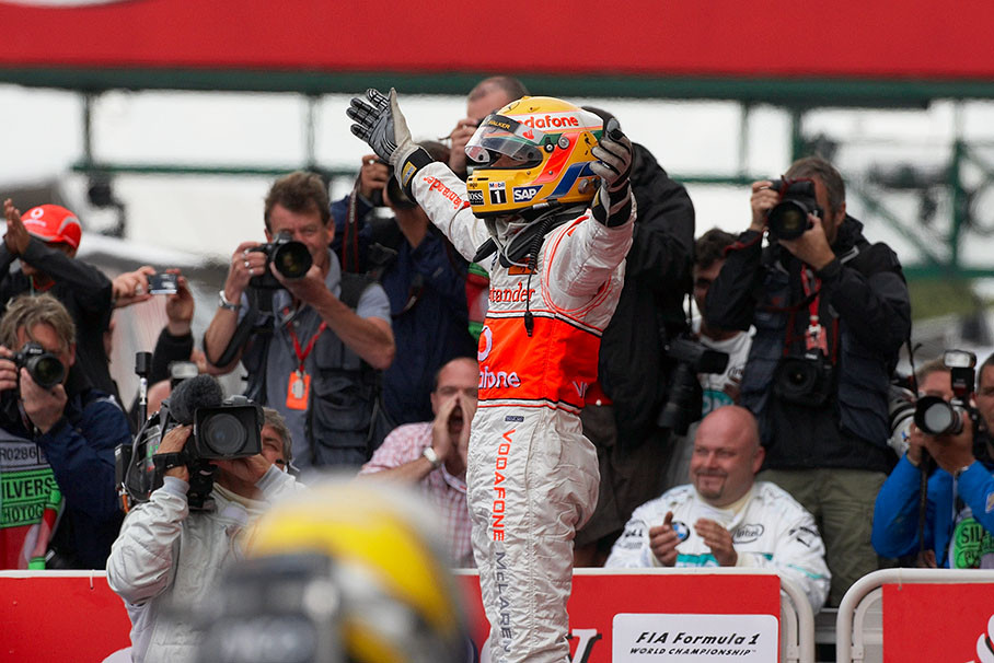 Lewis Hamilton celebrates his victory in parc ferme