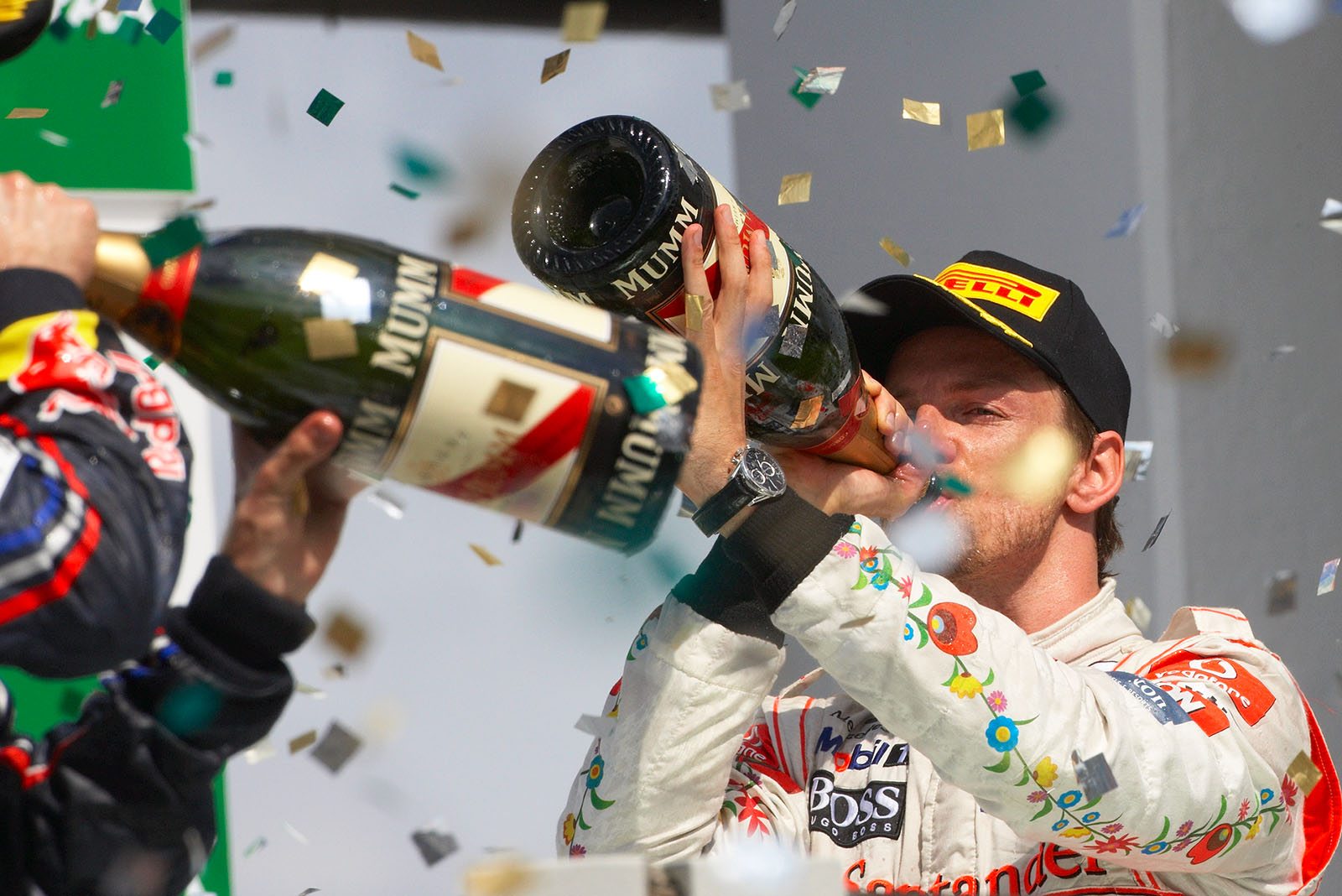 A large sip of champagne for third placed Jenson Button after the Brazilian Grand Prix