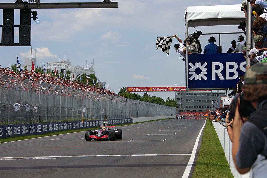 Lewis Hamilton receives chequered flag, wins his first Grand Prix and leads the World Championship
