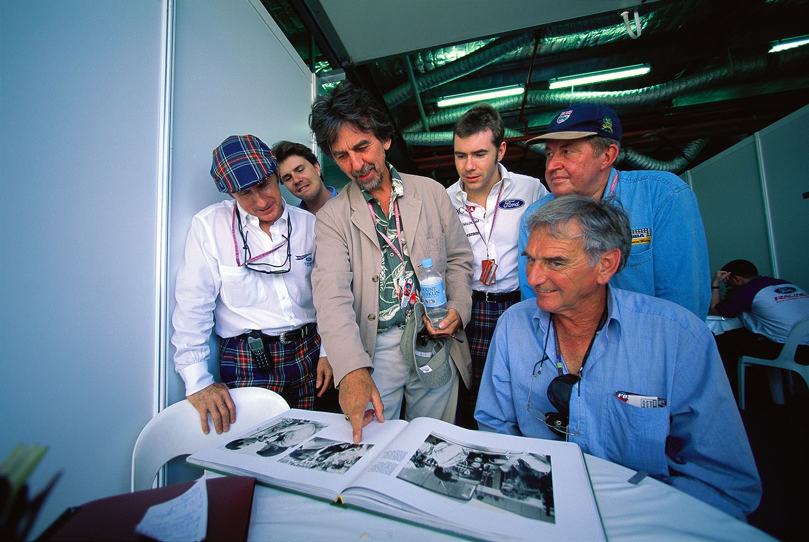 Rainer's new 'The Great Challenge 2 - The Stewart Era' editorial book, is being admired by Jackie Stewart, Mark Stewart, George Harrison, Paul Stewart and Eoin Young. (Who is the gentleman on the right hand? Any hint is appreciated!)