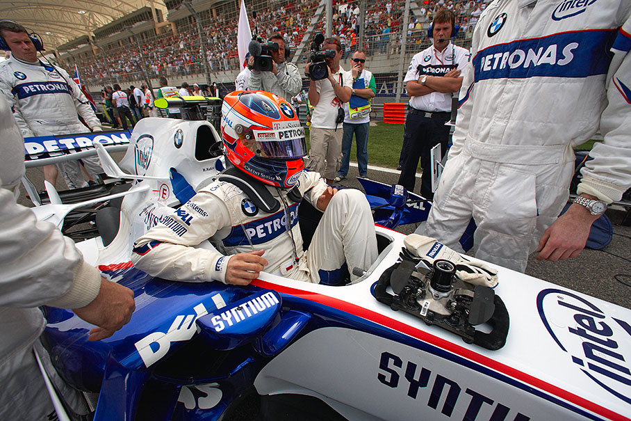 Polesitter Robert Kubica climbs into his cockpit