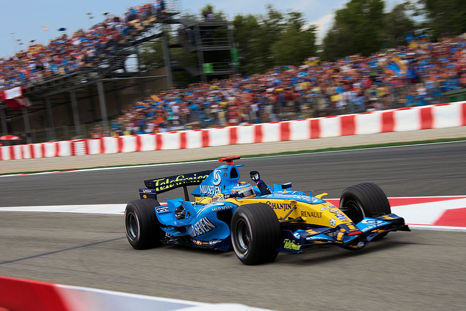 Fernando Alonso waving to his supporting fans after gaining pole position