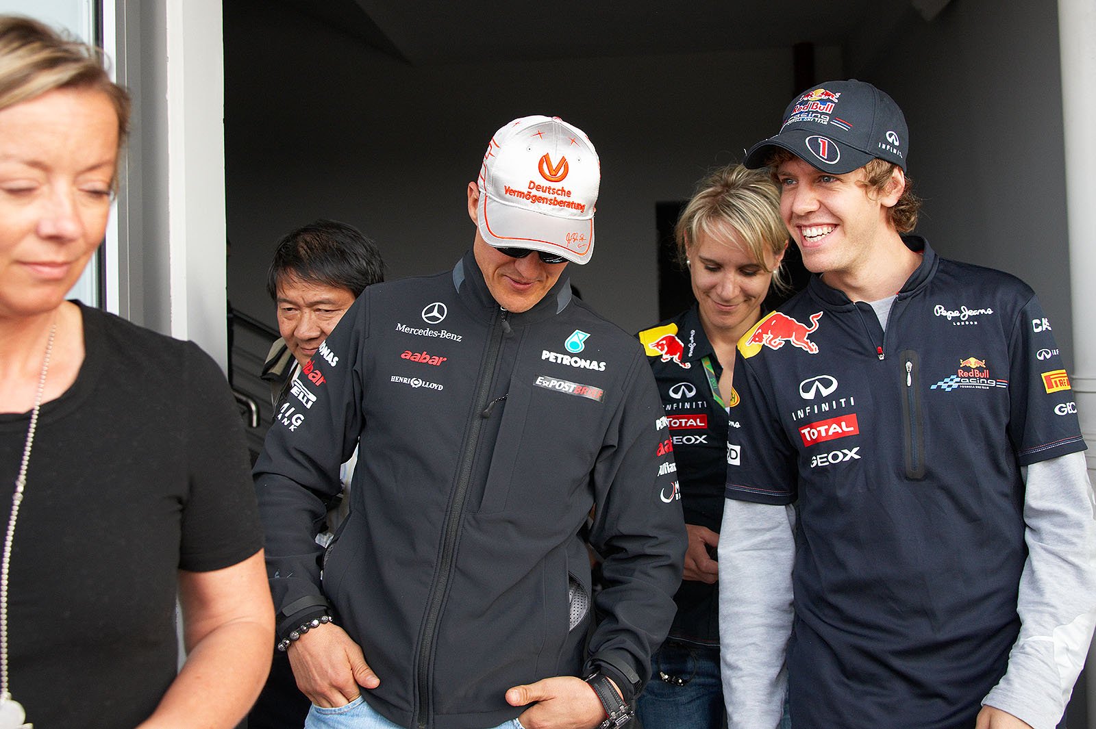Michael Schumacher and Sebastian Vettel exchange gossip and hints after the press conference