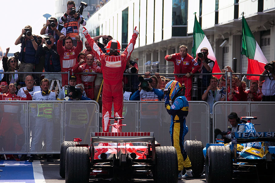 Michael Schumacher receiving ovations, note Jean Todt climbing the fence