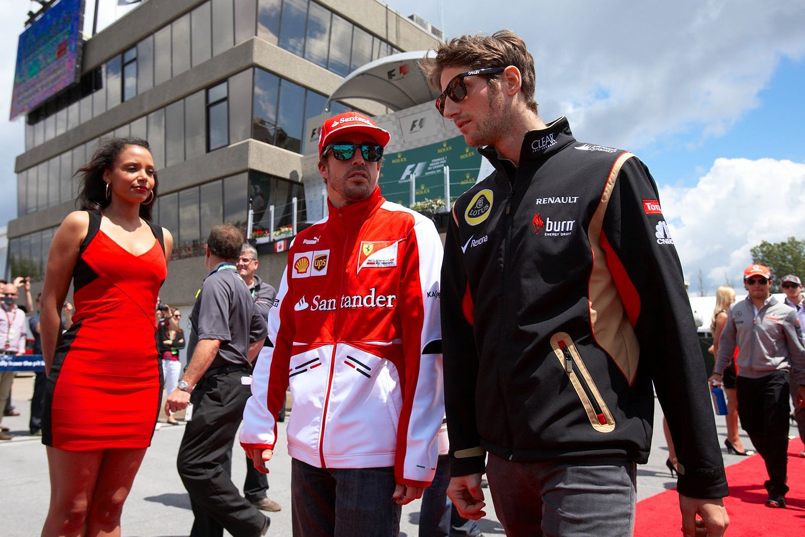 Fernando Alonso of Ferrari and Romain Grosjean of Lotus walk to drivers presentation