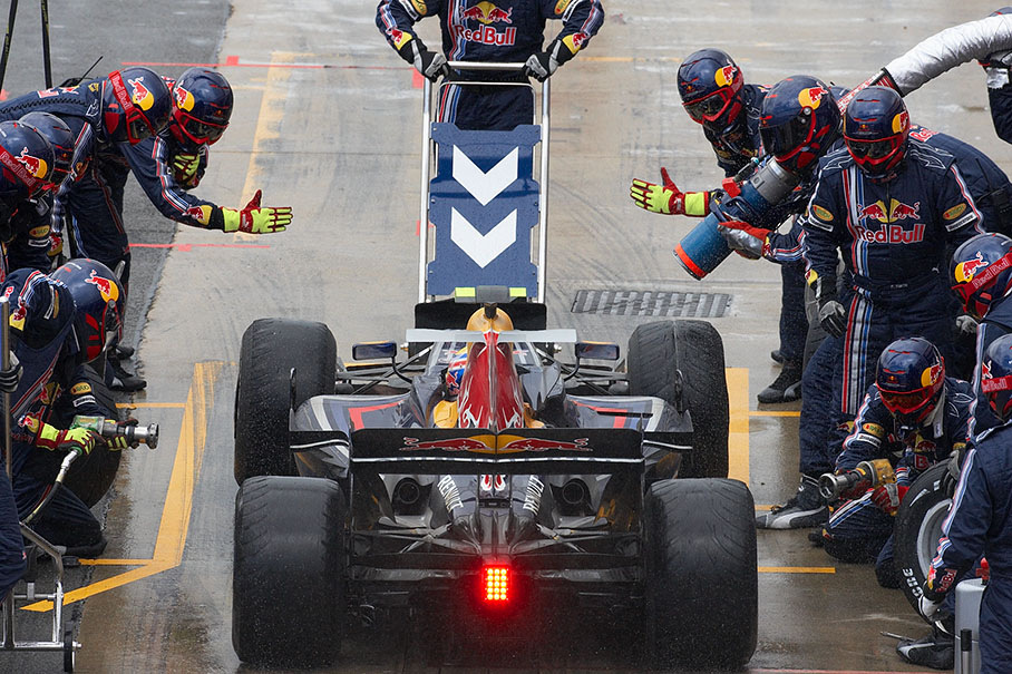 Mark Webber arrives at Red Bull pits with quite used intermediates in lap 28