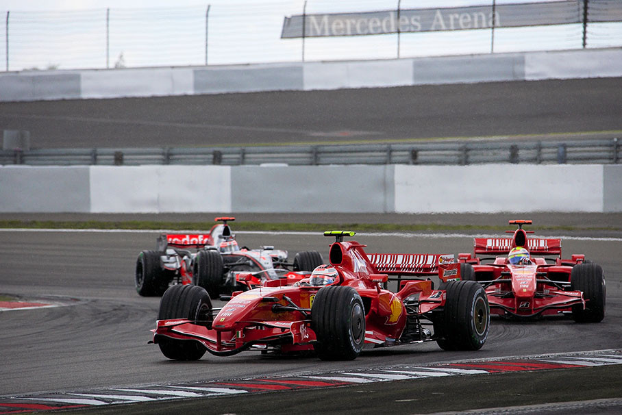 Kimi in a slight drift on an already slippy track