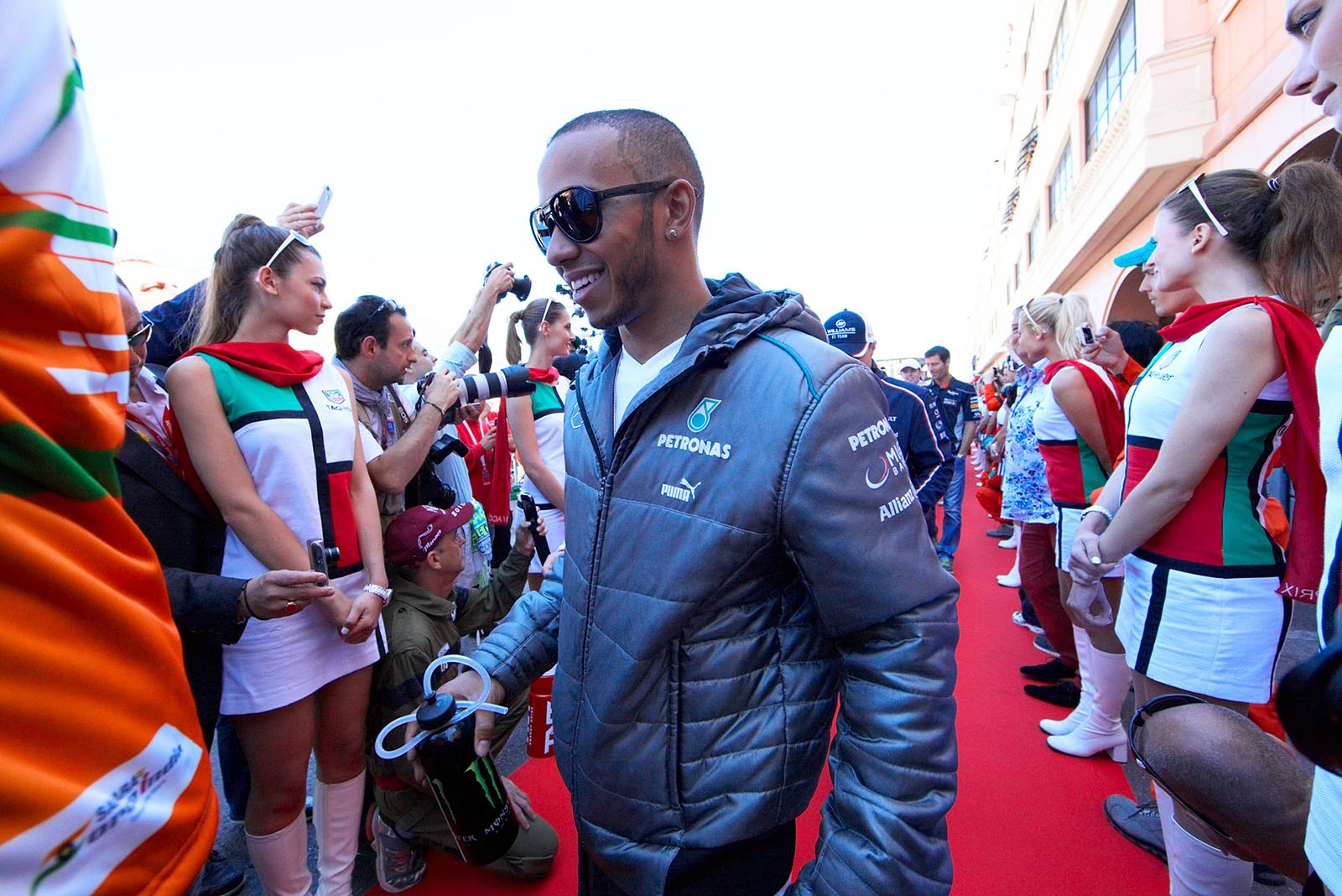 Lewis Hamilton walks to the drivers parade vehicle