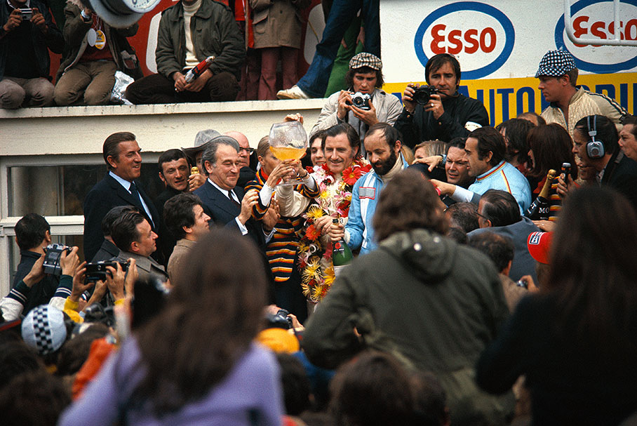 Pescarolo and Hill enjoy a sip of champagne