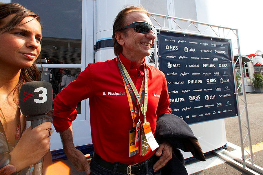 Emerson Fittipaldi, Formula One World Champion in 1972 and 1974, collects passes in Monza's paddock