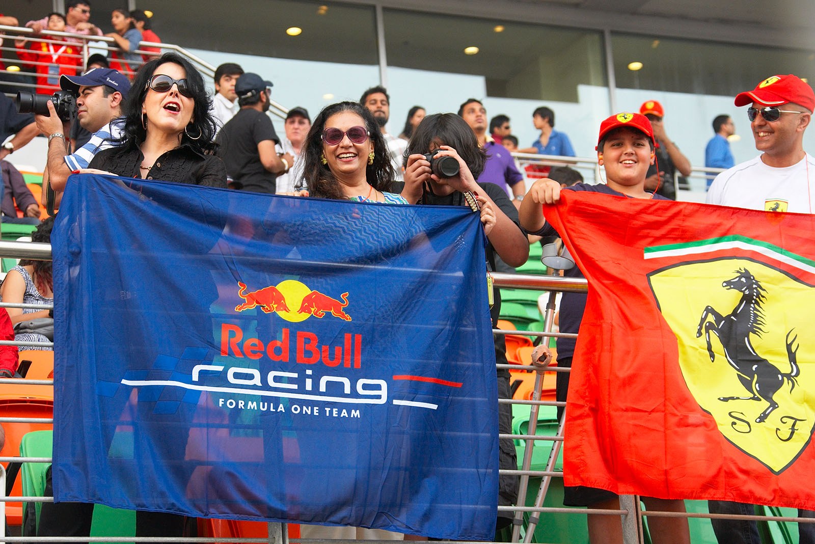 Racing fans cheer on the grandstand during the drivers parade