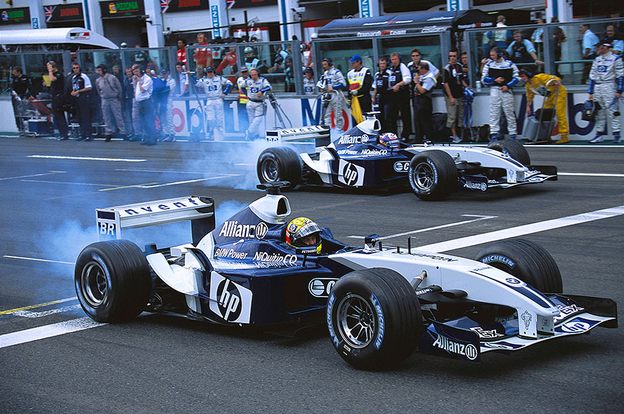 The two Williams-BMWs eject for warm-up lap, putting rubber on the track for the start