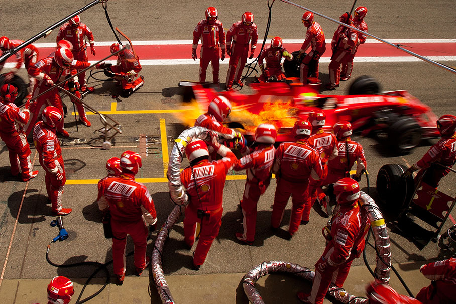 Felipe Massa's first pit stop, he continues racing with a long flame