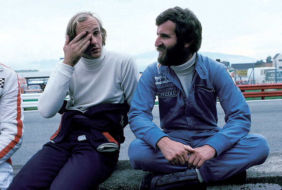 Hans-Joachim Stuck and Harald Ertl chat during the weekend of the Austrian GP 1975