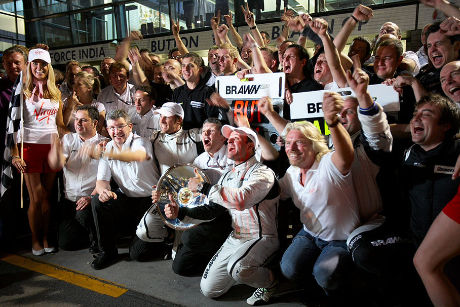 A memorable group photo of the cheering Brawn GP team after giving F1 the most exciting season start for a long time