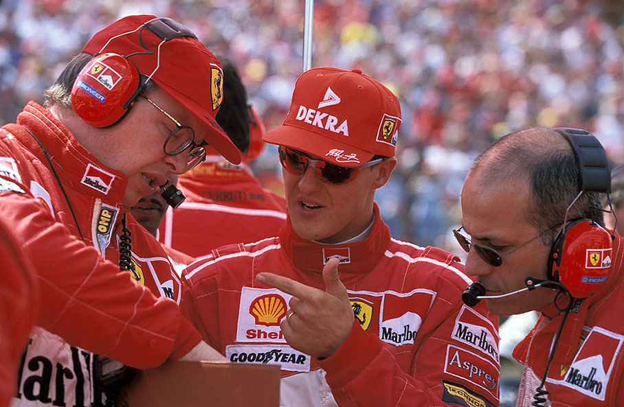 Ferrari's technical director Ross Brawn on the grid with Michael Schumacher and track engineer Ignazio Lunetta before the Hungarian GP 1997