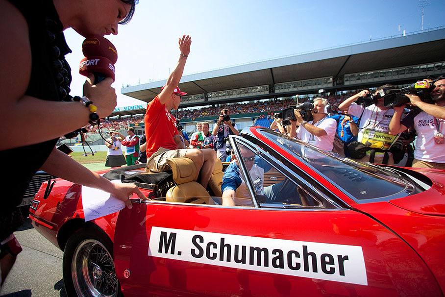 Michael Schumacher finishing his interview with TV presenter Tanja Bauer