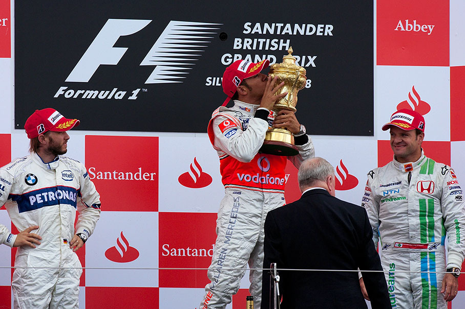 Winner Lewis Hamilton kisses his well-earned trophy