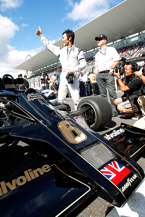 Takuma Sato drives a historical Lotus car